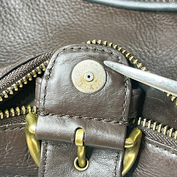 Sophisticated Brown Leather Travel Bag with Gold Accents by Coach - Picture 14 of 16